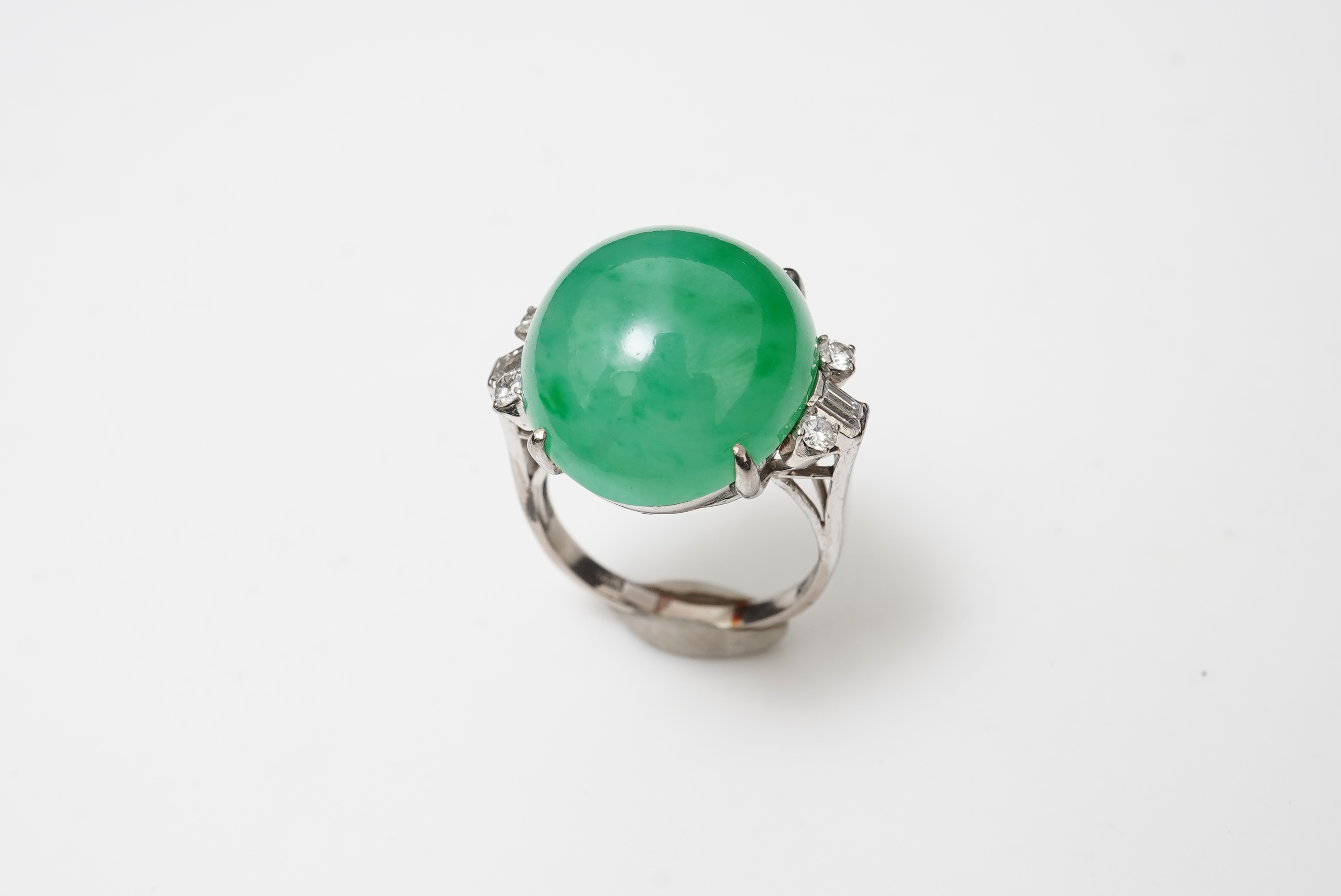 A jadeite and diamond ring